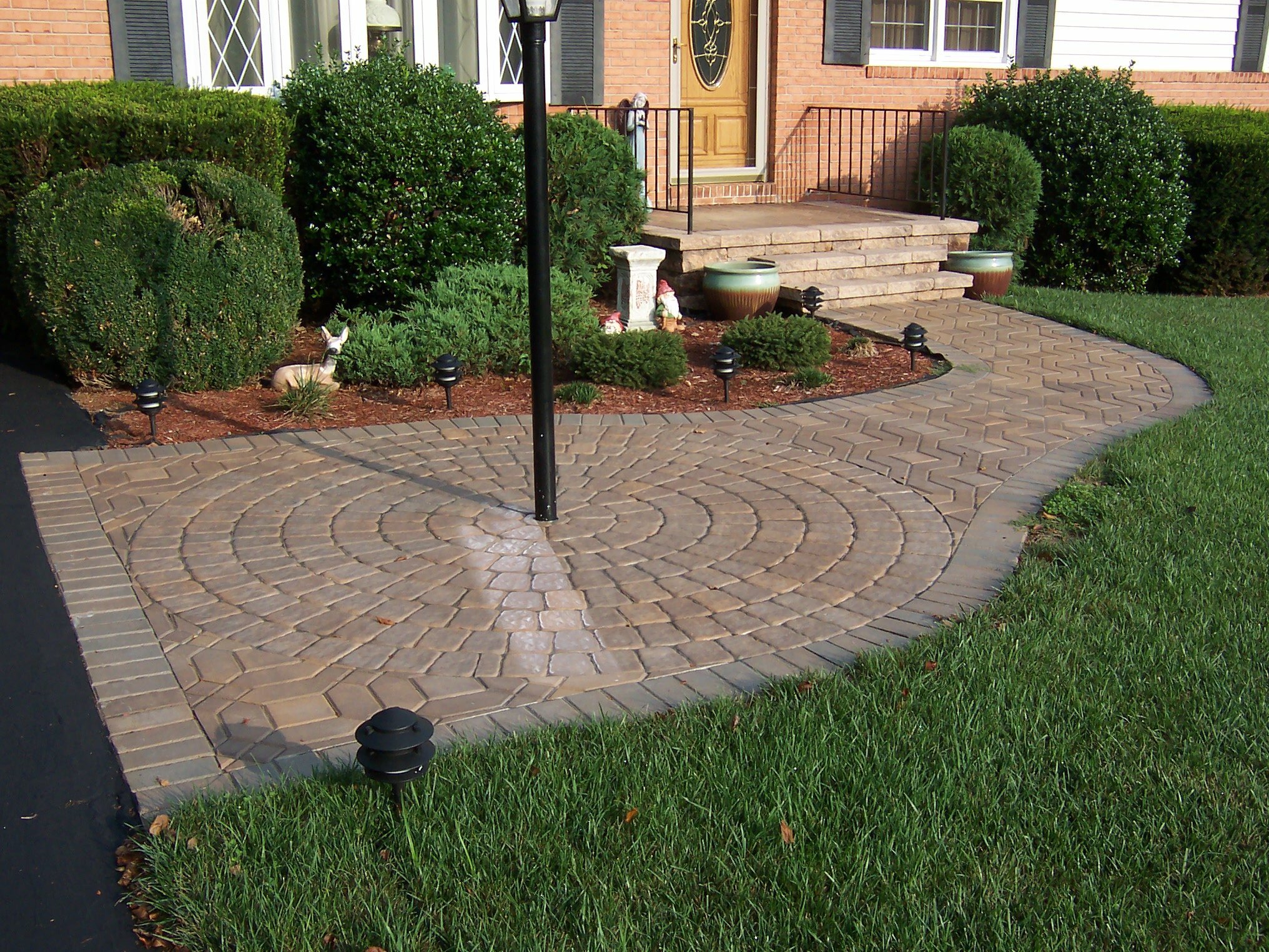 Sidewalk with raised landing and steps